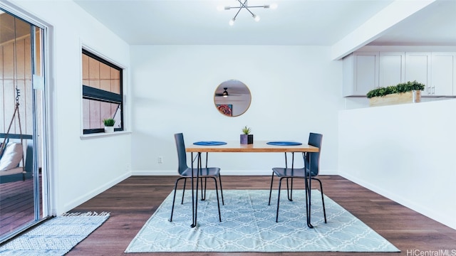 dining room with dark hardwood / wood-style floors