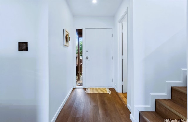 hallway with wood-type flooring