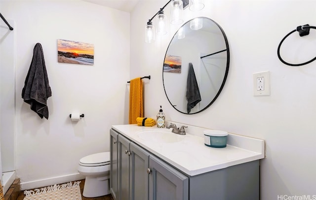 bathroom featuring vanity, toilet, and tile patterned floors