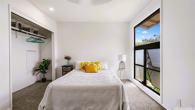 bedroom featuring dark colored carpet