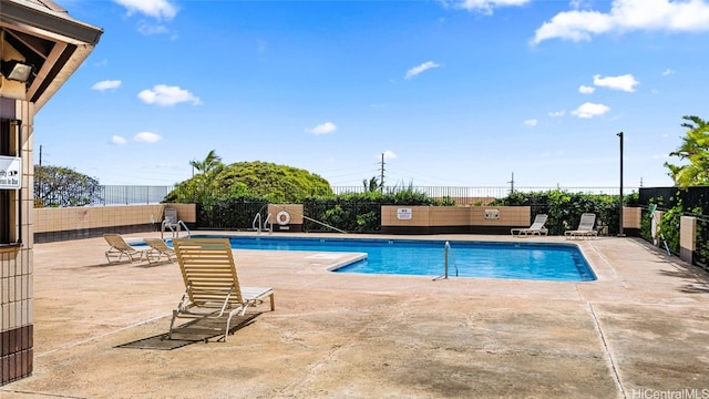 view of swimming pool with a patio