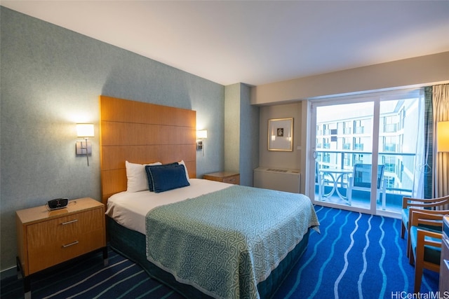 bedroom with dark colored carpet