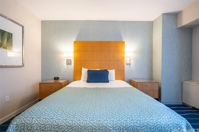 bedroom featuring dark colored carpet