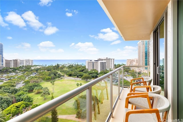 balcony featuring a water view