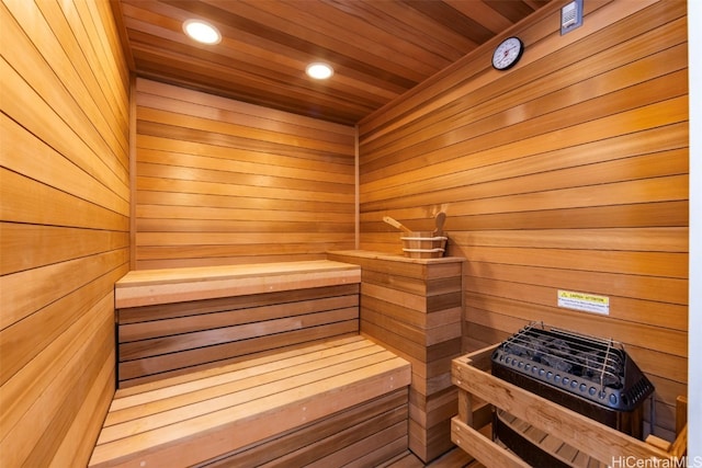 view of sauna / steam room with wooden walls and wooden ceiling