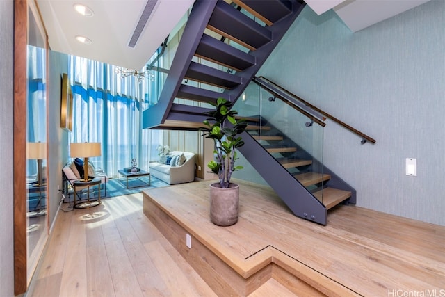 staircase featuring hardwood / wood-style flooring