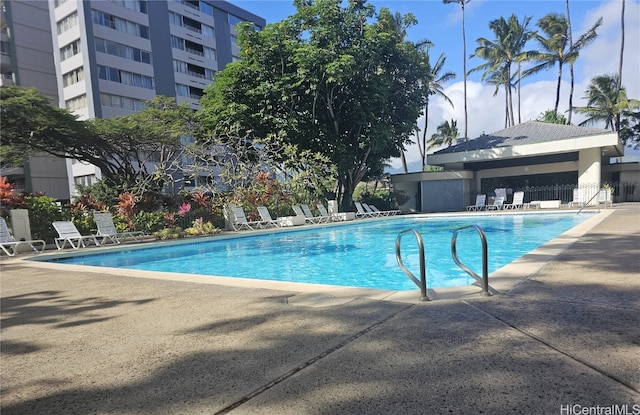 view of swimming pool with a patio