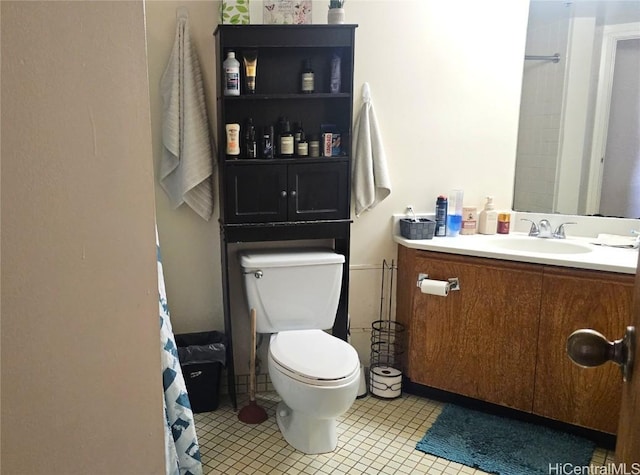 bathroom with vanity, tile patterned floors, and toilet