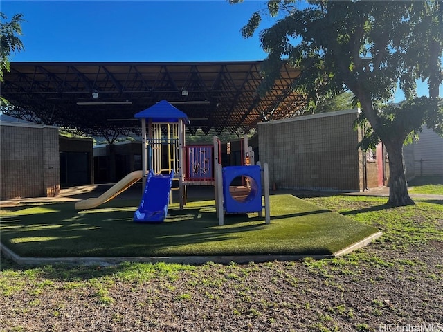 view of playground featuring a lawn