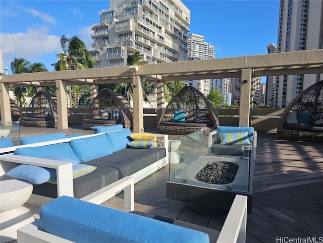 view of patio with a balcony and an outdoor living space