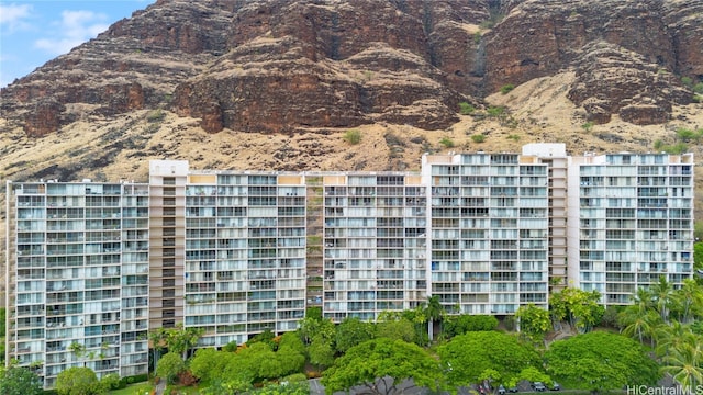 view of building exterior featuring a mountain view