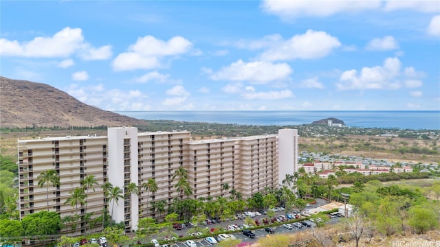 drone / aerial view with a water and mountain view