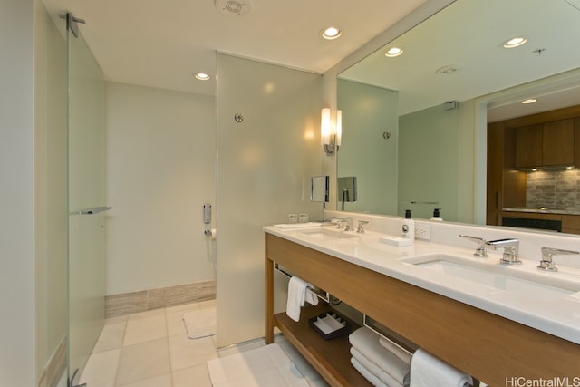 bathroom featuring vanity, tile patterned floors, and decorative backsplash