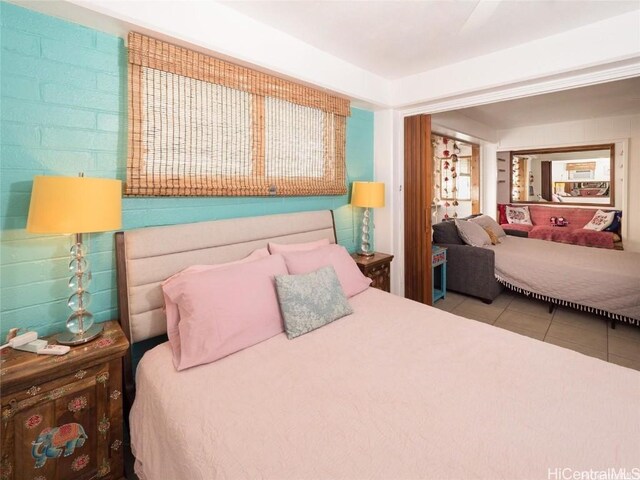 bedroom featuring light tile patterned floors