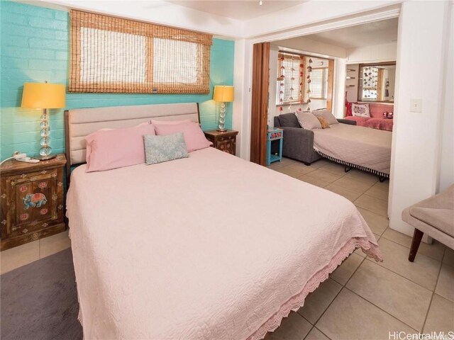 bedroom featuring tile patterned flooring