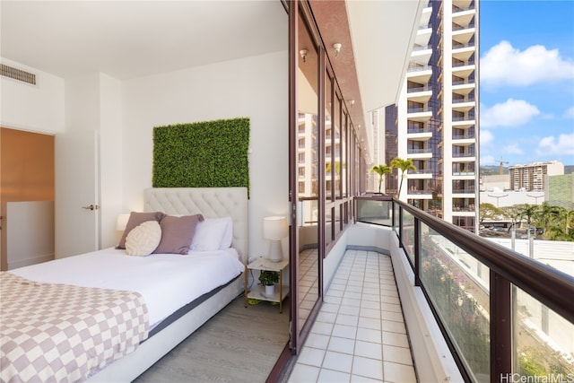 bedroom featuring light tile patterned floors