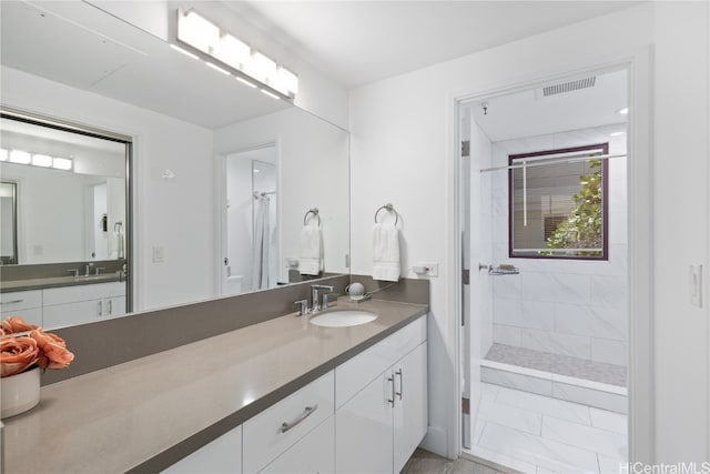 bathroom featuring vanity, a shower with shower curtain, and tile patterned flooring