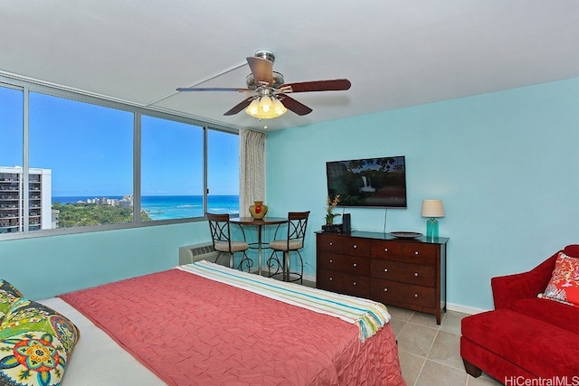 bedroom featuring ceiling fan and light tile patterned floors