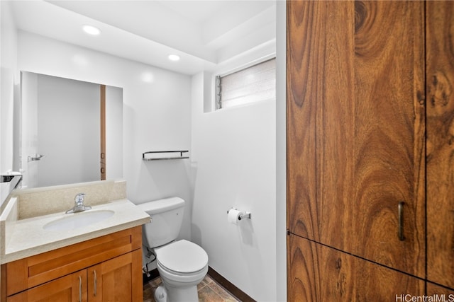 bathroom featuring vanity, toilet, and tile patterned floors