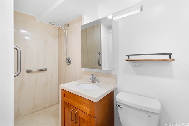 bathroom with vanity, toilet, and walk in shower