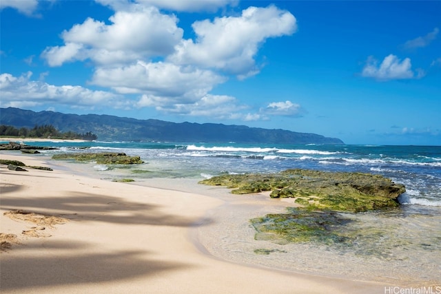 mountain view with a water view and a view of the beach