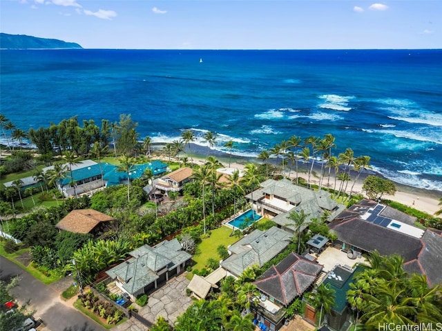 bird's eye view with a water view and a beach view