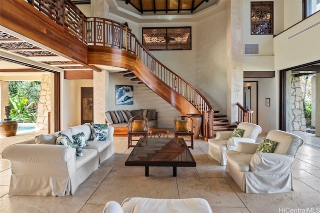 living room featuring a high ceiling