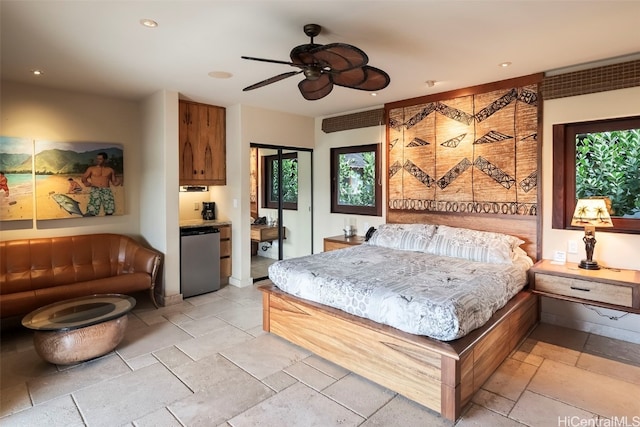 bedroom with multiple windows and ceiling fan