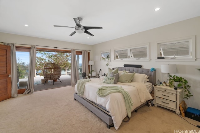 bedroom featuring light colored carpet, access to outside, and ceiling fan