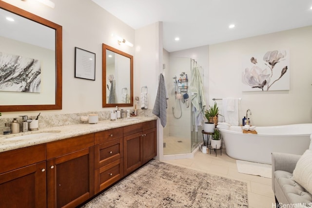 bathroom with vanity, tile patterned floors, and separate shower and tub