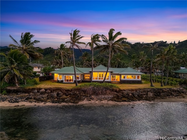 ranch-style house featuring a water view