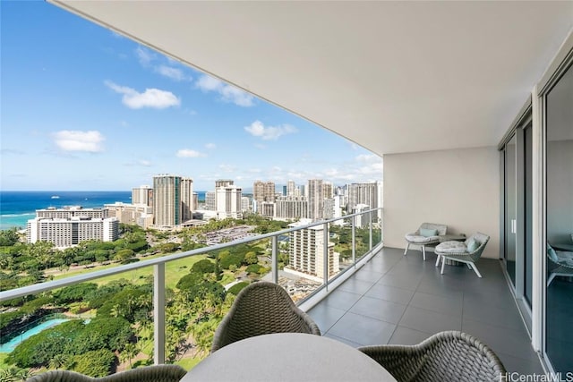 balcony with a view of city and a water view