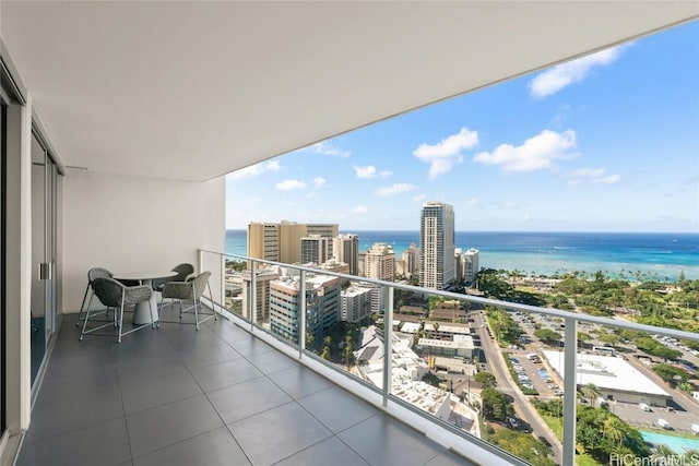 balcony with a view of city and a water view