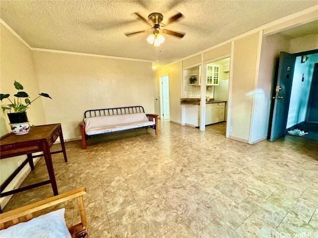 bedroom with ornamental molding, a textured ceiling, and ceiling fan