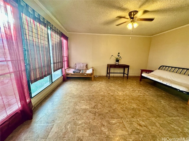 sitting room with crown molding, a textured ceiling, and ceiling fan