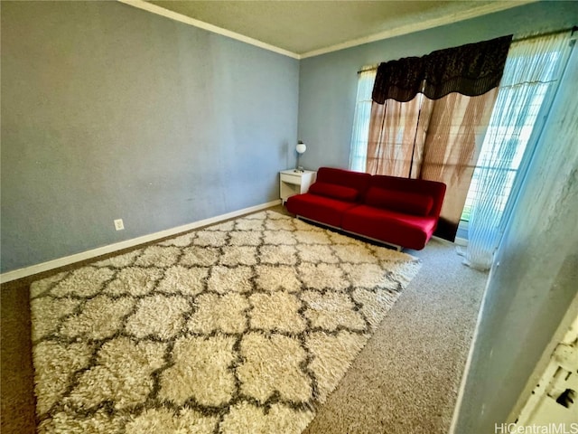 living area with crown molding and carpet