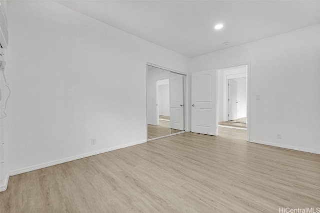 spare room featuring light hardwood / wood-style flooring