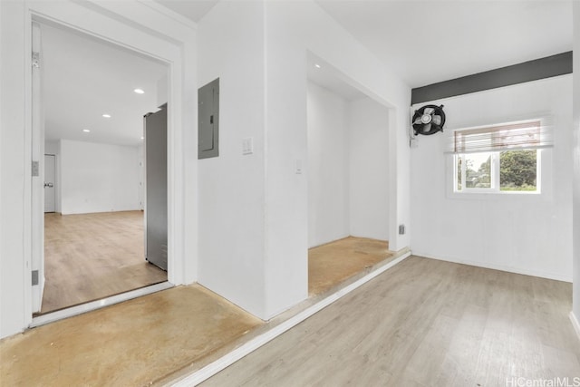 interior space with light hardwood / wood-style flooring and electric panel