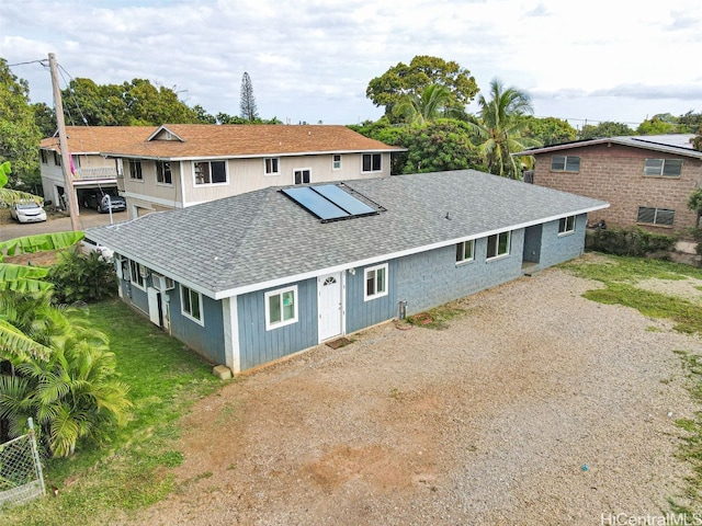 view of front of home featuring solar panels