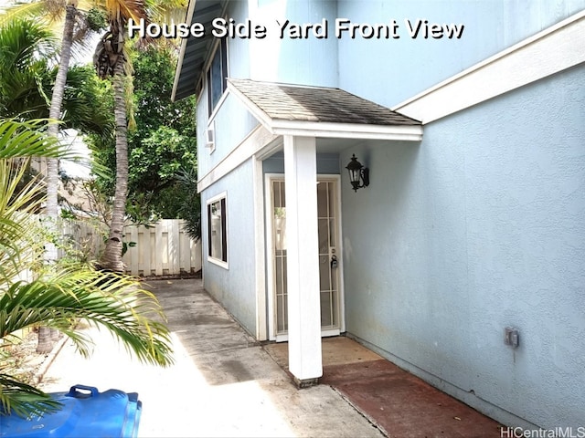 doorway to property with a patio