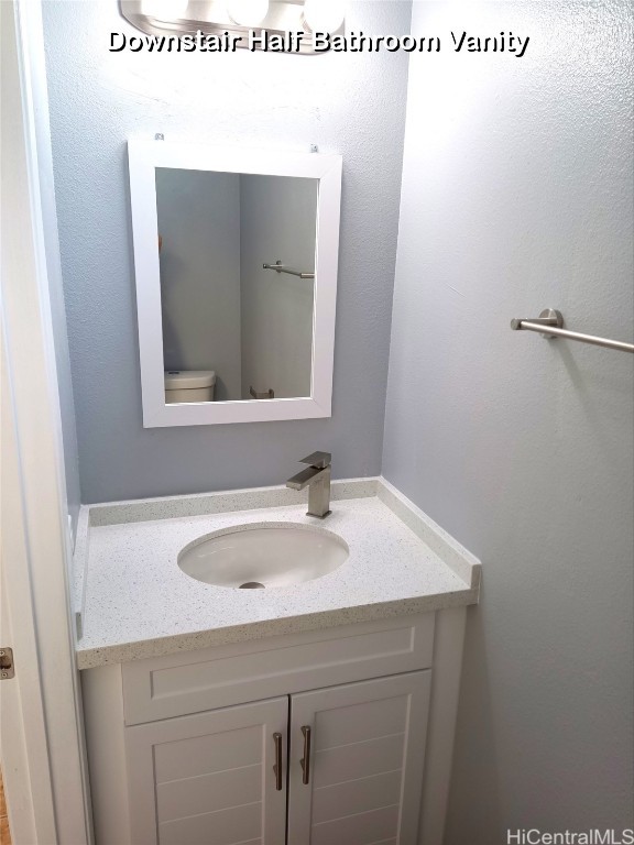 bathroom with vanity and toilet