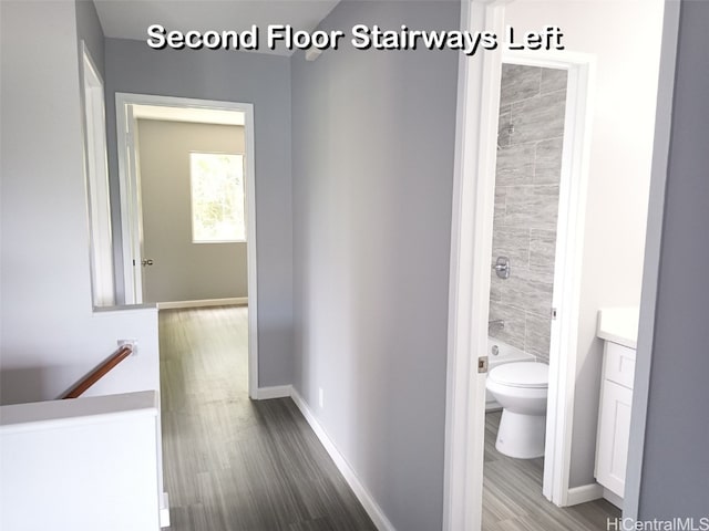 corridor featuring hardwood / wood-style floors