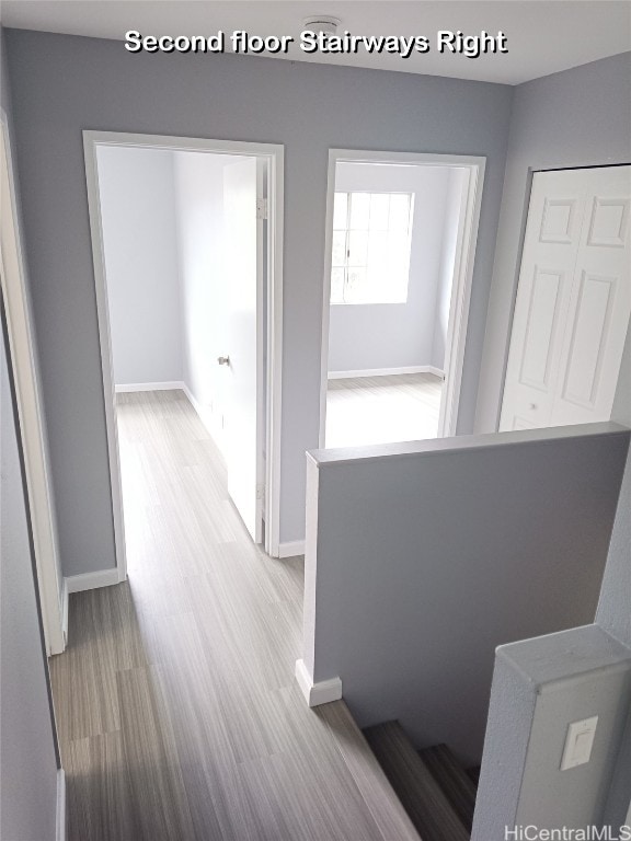 hall with light hardwood / wood-style floors