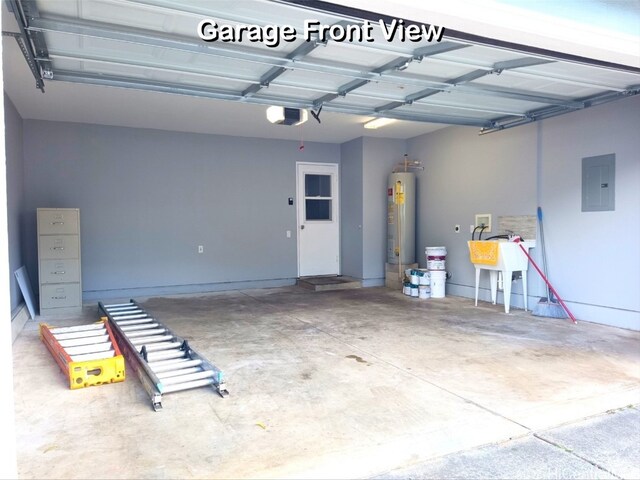 garage featuring a garage door opener, gas water heater, and electric panel