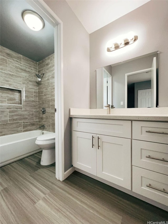 91-1021 Kuina St Unit 119, Ewa Beach, HI 96706 - full bath featuring wood finished floors, toilet, vanity, and shower / washtub combination