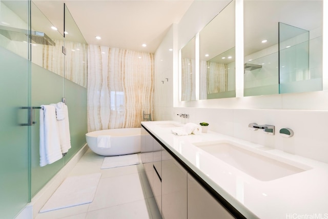 bathroom featuring vanity, plus walk in shower, and tile patterned floors