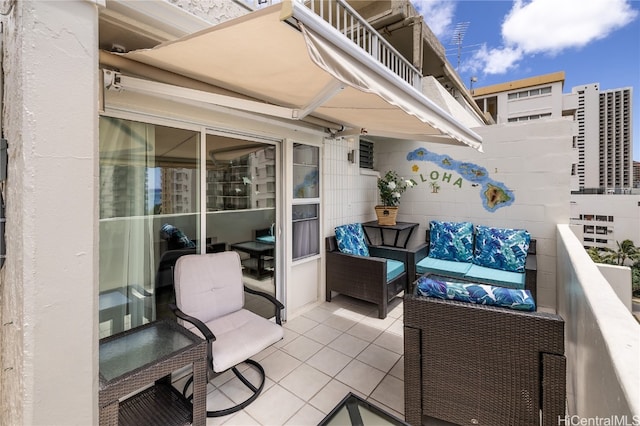 balcony with a patio area and an outdoor living space