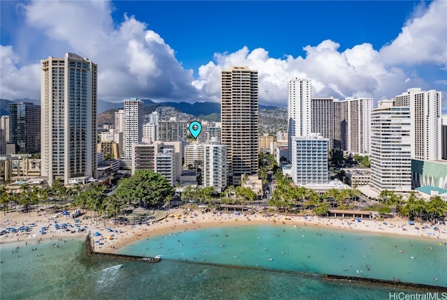 view of city featuring a water view and a beach view