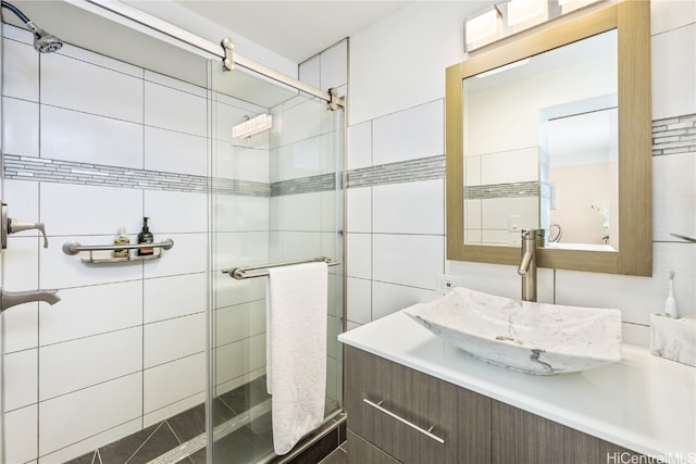 bathroom with vanity and an enclosed shower