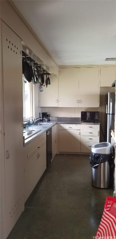 kitchen with gas cooktop, stainless steel dishwasher, and sink